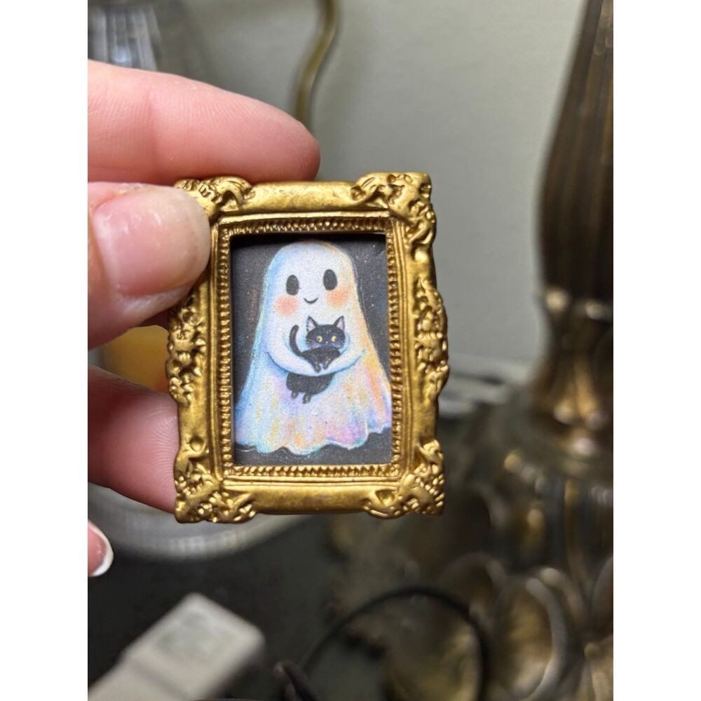 Halloween Ghost holding a Black Cat